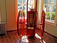 'Wheel to Fire' mobile firefighting apparatus by O.J. Childs Co. of Utica, New York inside The Waldorf (1929) at Pebble Hill Plantation.
