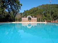 Swimming pool (1920) and the Bath House (1922) beyond at Pebble Hill Plantation.