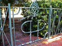 PHP logo gate at the swimming pool (1920) at Pebble Hill Plantation.