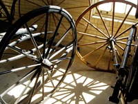 Wheels in the Stable Complex (1928) Carriage Room at Pebble Hill Plantation.