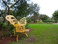 Butterfly bench and the seashore paspalum lawn in Marina Park near the community garden demonstration area.