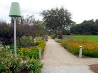 Path through the community garden demonstration areas in Marina Park.