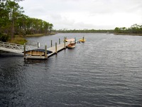 Small vessels and the Boathouse Dock on Western Lake from Steadfast 4-Ton Pedestrian/Light Vehicle Bridge 031770 (2003) connecting Marina Park and Cerulean Park North.