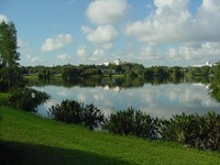Reflections in Lake Estelle and the Orlando Science Center beyond.