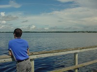 Chris Benitez looking out at Lake Minneola from the boardwalk.