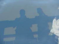 Shadows of David July and Chris Benitez in Lake Minneola.