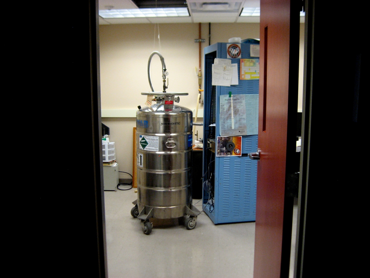 A tank labeled 'non-magnetic' inside a laboratory.