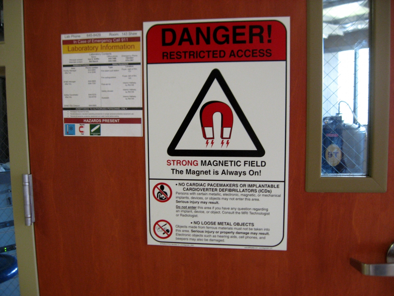 'Danger! Restricted Access' sign on magnet lab door.