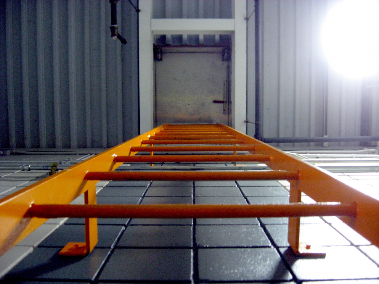 Ladder and hatch in the DC Field wing corridor.