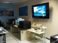 Telephones, displays and computers in the Miami-South Florida Weather Forecast Office at the National Hurricane Center.