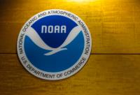 NOAA logo in the media room before the tour of the National Hurricane Center.