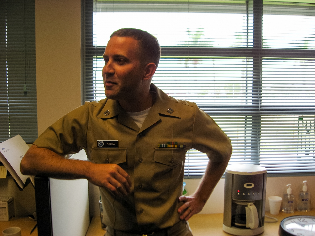 NOAA Corps Lieutenant Jeffrey Pereira discussing his role in the Storm Surge Unit of the National Hurricane Center.