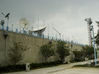 Rooftop satellite dishes, antennas and the eastern exterior wall of the National Hurricane Center.