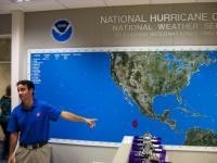 Hurricane Specialist John Cangialosi points toward Tropical Storm Aletta on the storm tracking map in the operations center of the National Hurricane Center.