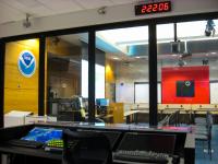 Broadcast desk and the media room beyond in the operations center of the National Hurricane Center.