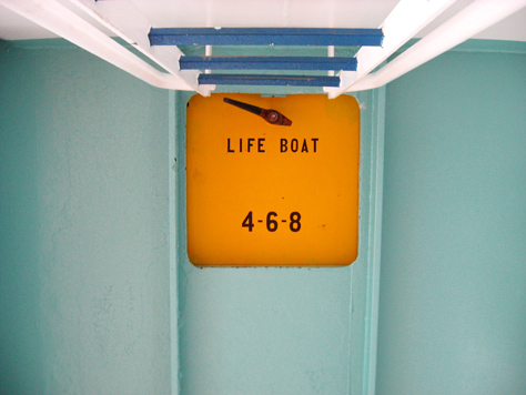 Photo Credit: David July — Up the white and blue ladder to the orange hatch for lifeboats 4, 6 and 8, seen on the Deck 10 port exterior corridor on Carnival Sensation, Atlantic Ocean, off the coast of Florida, 10 March 2011
