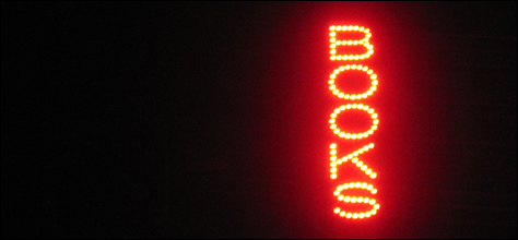Photo Credit: David July — At 2319 hours, a red LED "Books" sign is the only illumination inside Voltaire Books, 330 Simonton Street, Key West, Florida, 09 November 2008