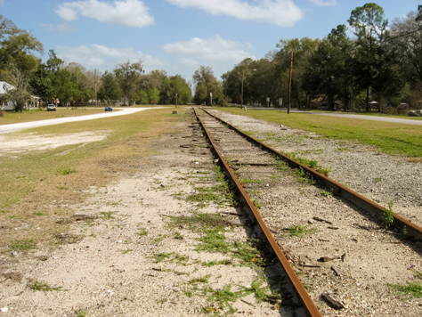 Photo Credit: David July — The old Savannah, Florida and Western Railroad tracks (1884) running southeast through High Springs near Main Street, High Springs, Florida: 19 February 2012