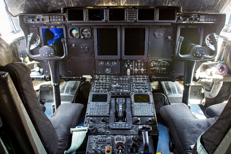Photo Credit: David July — Captain and first officer's seats, control columns, instrument panels and the pedestal in the cockpit aboard United States Air Force Reserve 403d Wing 53d Weather Reconnaissance Squadron 'Hurricane Hunters' WC-130J Hercules 75304, Tallahassee, Florida: 22 May 2014