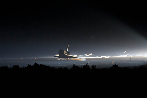 Photo Credit: NASA/Bill Ingalls — STS-135 Landing 201107210002HQ, Space shuttle Atlantis (STS-135) touches down at NASA's Kennedy Space Center Shuttle Landing Facility (SLF), completing its 13-day mission to the International Space Station (ISS) and the final flight of the Space Shuttle Program, 21 July 2011, Cape Canaveral, Florida