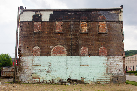 Photo Credit: David July — The back wall of the Titusville Moose Lodge building (1873) that abutted a two-floor KFC until Tuesday, 27 August 2013 when the latter was demolished, Titusville, Pennsylvania: 24 June 2014
