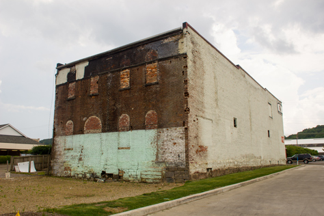 Photo Credit: David July — The back wall of the Titusville Moose Lodge building (1873) that abutted a two-floor KFC until Tuesday, 27 August 2013 when the latter was demolished, Titusville, Pennsylvania: 24 June 2014