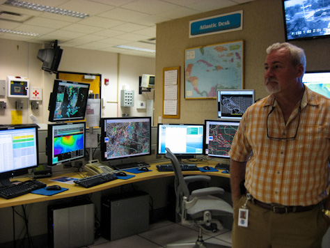 Photo Credit: David July — Meteorologist Martin Nelson at Atlantic Desk in the Tropical Analysis and Forecast Branch unit of the National Hurricane Center, 11691 SW 17th Street, Miami, Florida, 15 May 2012