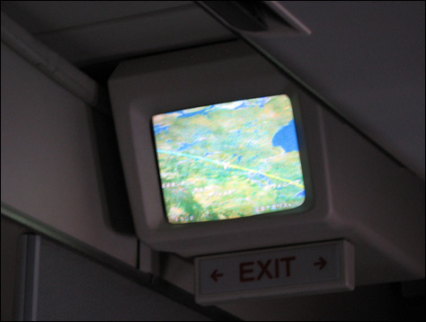 Photo Credit: David July — Northwest Airlines Flight 11 cabin GPS displaying our present location, somewhere over Canada, 13 March 2008