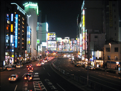 Photo Credit: David July — Looking east down Road Four from the pedestrian overpass near the Sompo Japan Headquarters Building, Shinjuku, Tokyo, Japan, 15 March 2008
