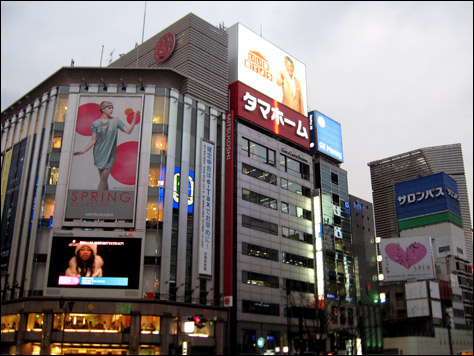 Photo Credit: David July — Large video displays and illuminated signs decorate the Mitsukoshi and nearby buildings, Ginza, Tokyo, Japan, 17 March 2008