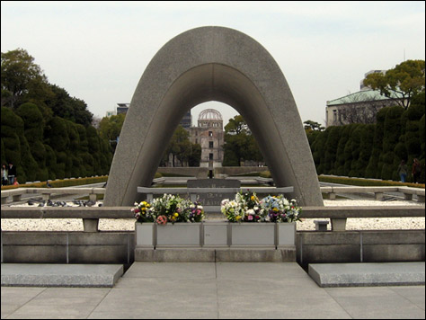 Photo Credit: David July — The Cenotaph for the A-Bomb Victims beyond which lays the Flame of Peace and Genbaku Dome, Hiroshima Peace Memorial Park, Hiroshima, Japan, 18 March 2008