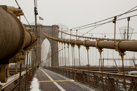Photo Credit: David July — Three of the four main cables leading up to the eastern side of the eastern tower of the Brooklyn Bridge (1883) from the pedestrian and cyclist promenade, Brooklyn, New York: 26 January 2014