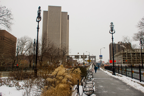Photo Credit: David July — Looking back to the Brooklyn Bridge (1883) and its pedestrian and cyclist promenade from the Manhattan terminus at Centre Street, New York, New York: 26 January 2014