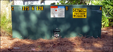 Photo Credit: David July — High voltage electrical box 3756S28 with two way feed, Forest Street at Tupelo Street, Seaside, Florida, 26 November 2010