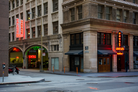 Photo Credit: David July — The corner of New Montgomery and Stevenson Street, featuring neon signs for the Palace Hotel parking garage and The House of Shields saloon, San Francisco, California, 26 January 2013