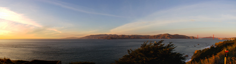Photo Credit: David July — Sunset panorama of the Golden Gate strait: the Pacific Ocean, Marin Headlands, Mile Rock Lighthouse (1906) and Golden Gate Bridge (1937) from the Lifesaving Station Overlook on the Coastal Trail at Lands End in the Golden Gate National Recreation Area, San Francisco, California: 21 January 2013