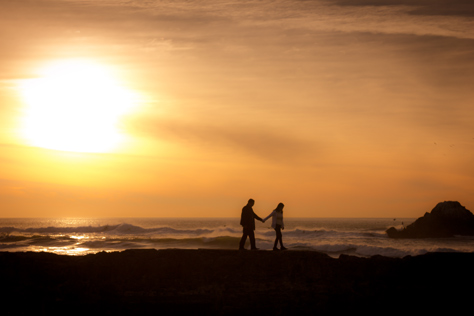 Photo Credit: David July — Two people navigate the Sutro Baths (1896) western wall ruins hand in hand as the sun prepares to set, San Francisco, California, 21 January 2013