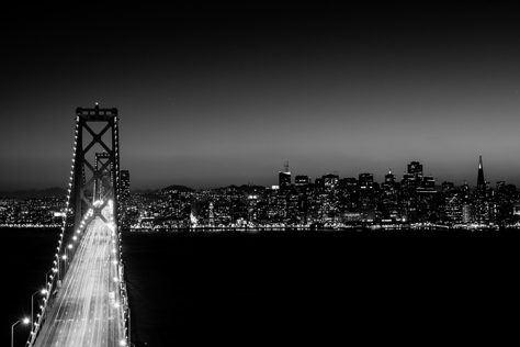 Photo Credit: David July — Interstate 80 over the western span of the San Francisco–Oakland Bay Bridge (1936) and downtown San Francisco from Yerba Buena Island, San Francisco, California, 26 January 2013