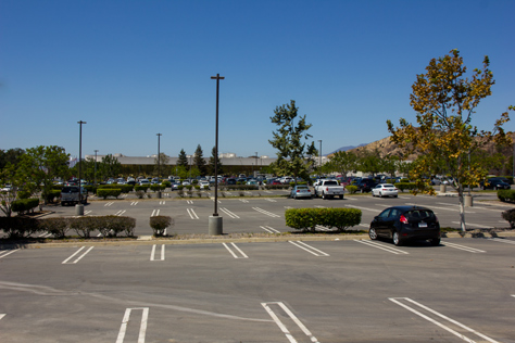Photo Credit: David July — Looking west at my rental car in the last row of parking east of 400 National Way (1984), the fictional PlayTronics headquarters building in 'Sneakers' (1992), Simi Valley, California: 22 August 2013
