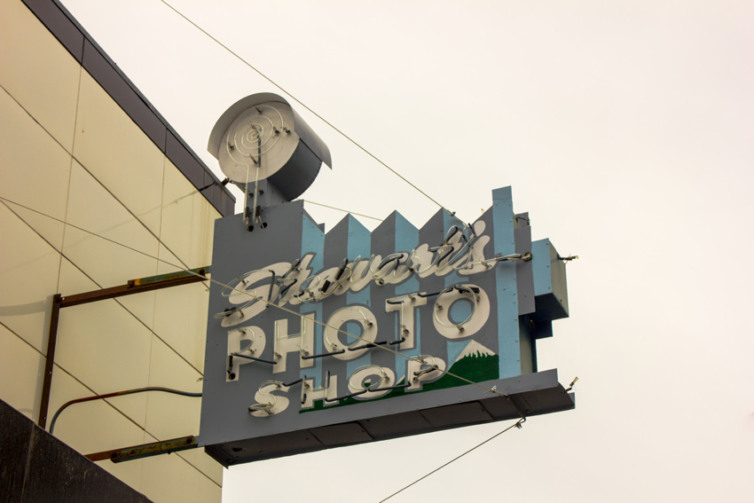 The neon sign for Stewart's Photo Shop at the Ship Creek Meat Market building (1936) in downtown Anchorage