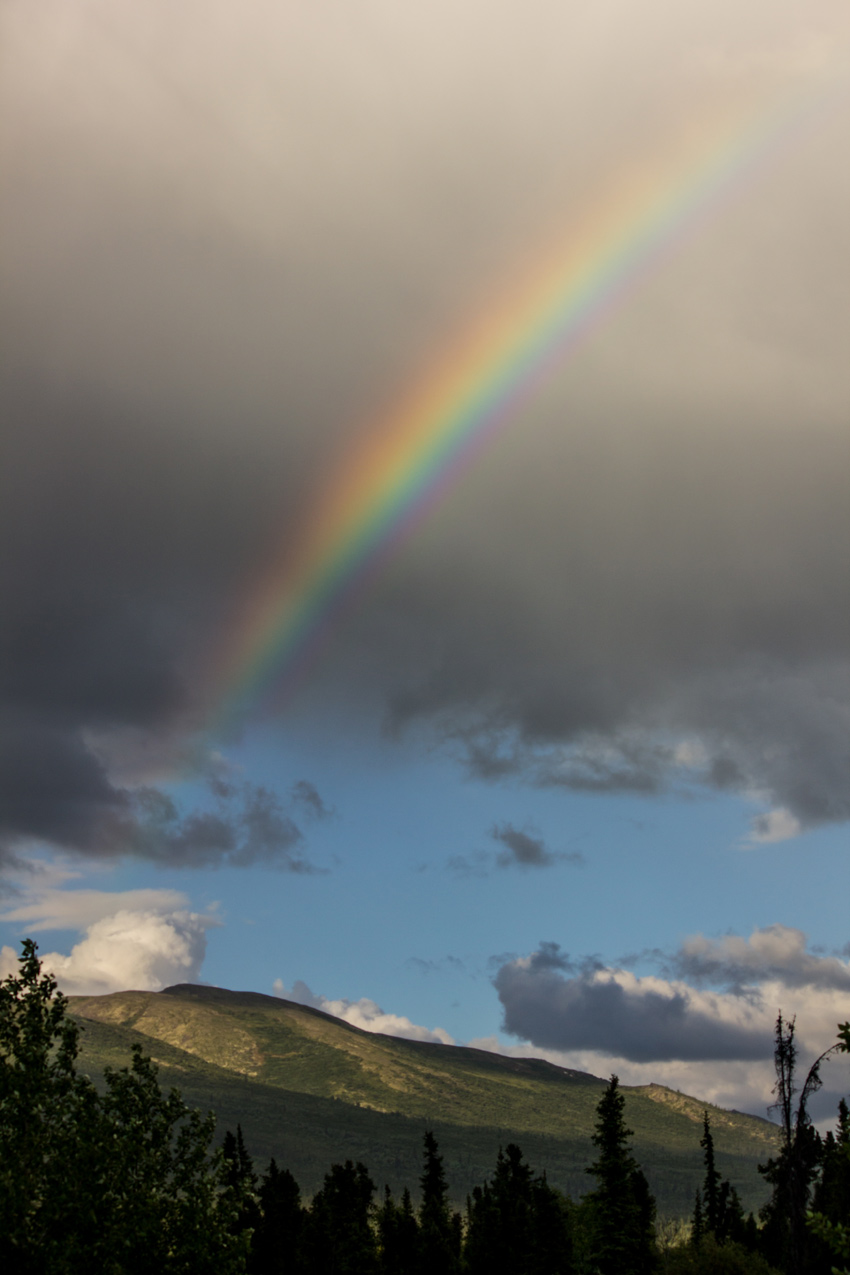An extremely bright and vivid rainbow in the sky over Coldfoot seen from the parking lot of the Arctic Interagency Visitor Center (2004)