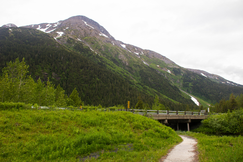 Portage Glacier Road crossing Williwaw Creek with the Kenai Mountains beyond on the Williwaw Nature Trail in the Chugach National Forest