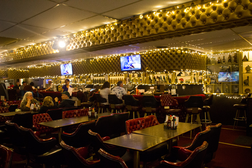 Strings of lights, padded walls and red vinyl seating inside Thorn's Showcase Lounge