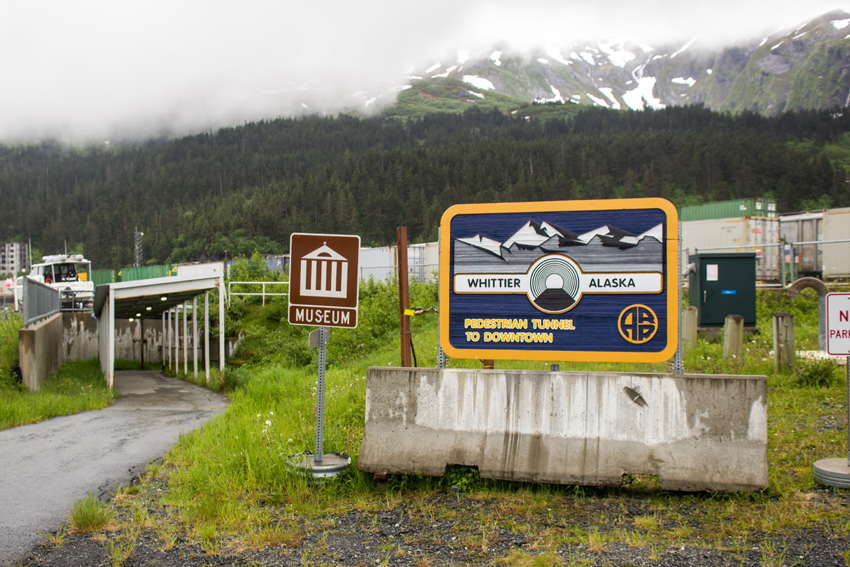 Sign and northern entranceway for the pedestrian tunnel (2000) built under Whittier Yard by the Alaska Railroad Corporation