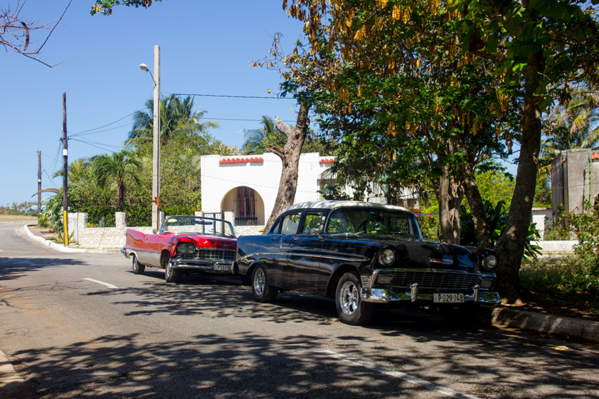 1956 Chevrolet Bel Air and an vintage convertible parked on the street in La Habana del Este, Havana, Cuba