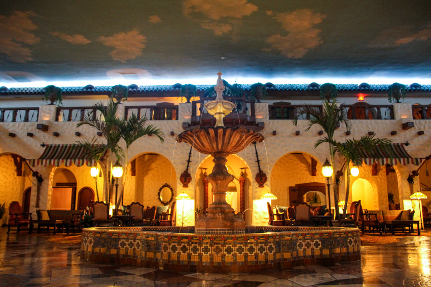 Emerging from the Iberian Lounge into the Cuban-inspired faux courtyard called The Fountain Lobby inside The Hotel Hershey (1932) in Hershey, Pennsylvania