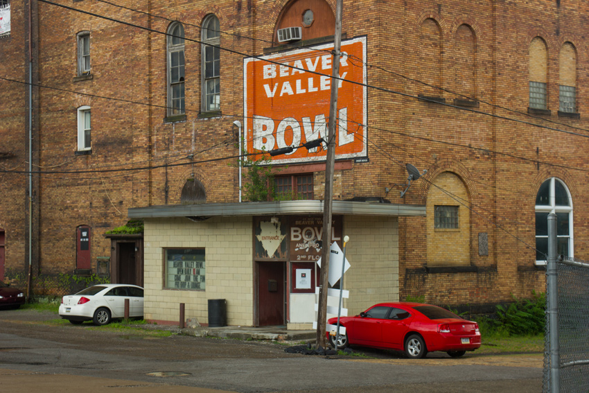 Main entrance and signs for Beaver Valley Bowl at the Beaver Valley Brewery Company Building (1903) in Rochester, Pennsylvania