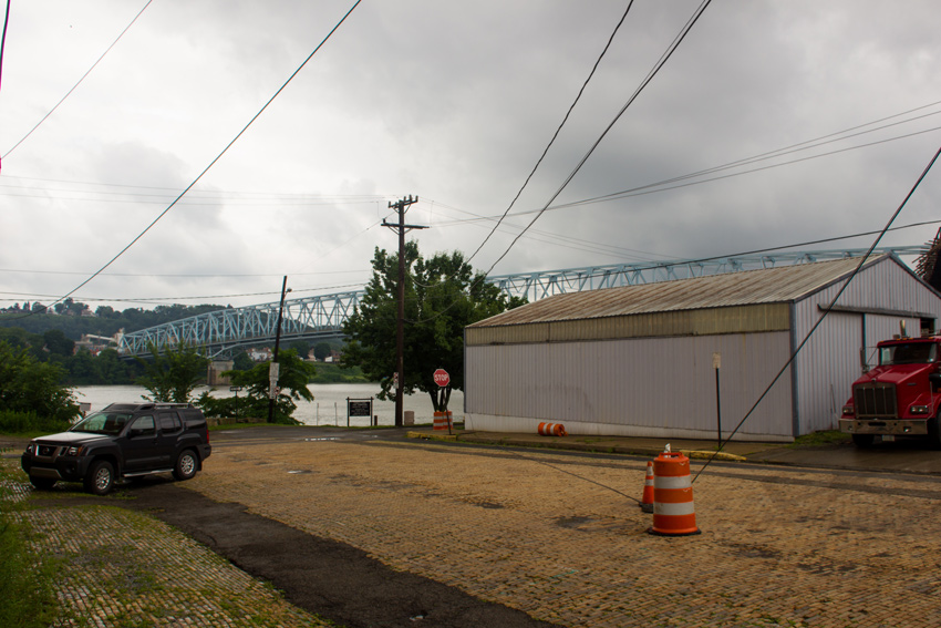 Power lines on and above New York Avenue, the Ohio River and Rochester-Monaca Bridge (1986) from the foot of the Beaver Valley Brewery Company Building (1903) in Rochester, Pennsylvania