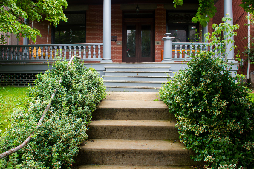 The front stairs, porch and door of the old style single family home at 359 South Atlantic Avenue (1913) in the Friendship neighborhood of Pittsburgh, Pennsylvania