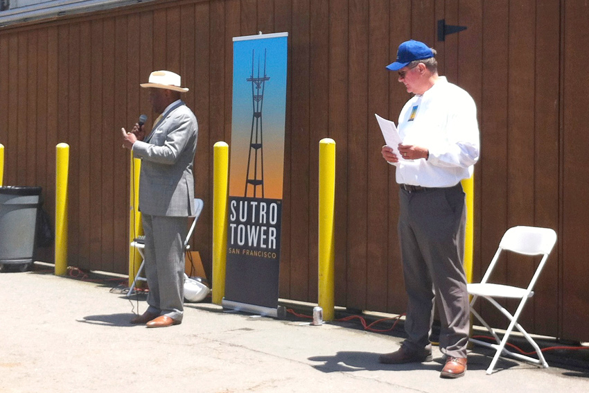 Former Mayor Willie Brown speaking at Sutro Tower's 40th birthday party while Eric Dausman looks on